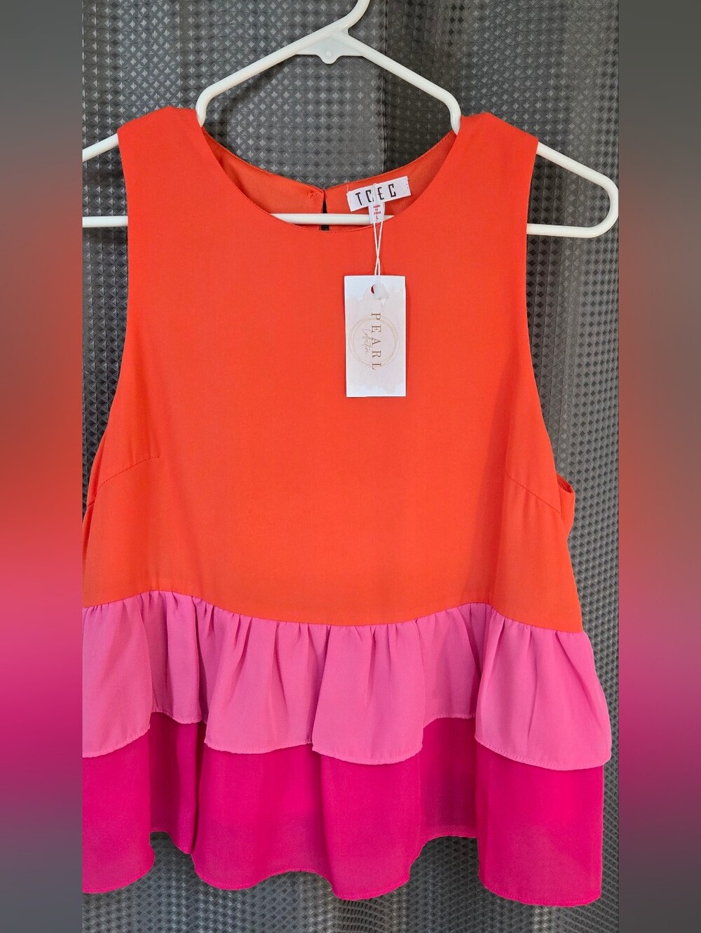 TCEC Sleeveless Coral-Orange Round Neck Peplum Top